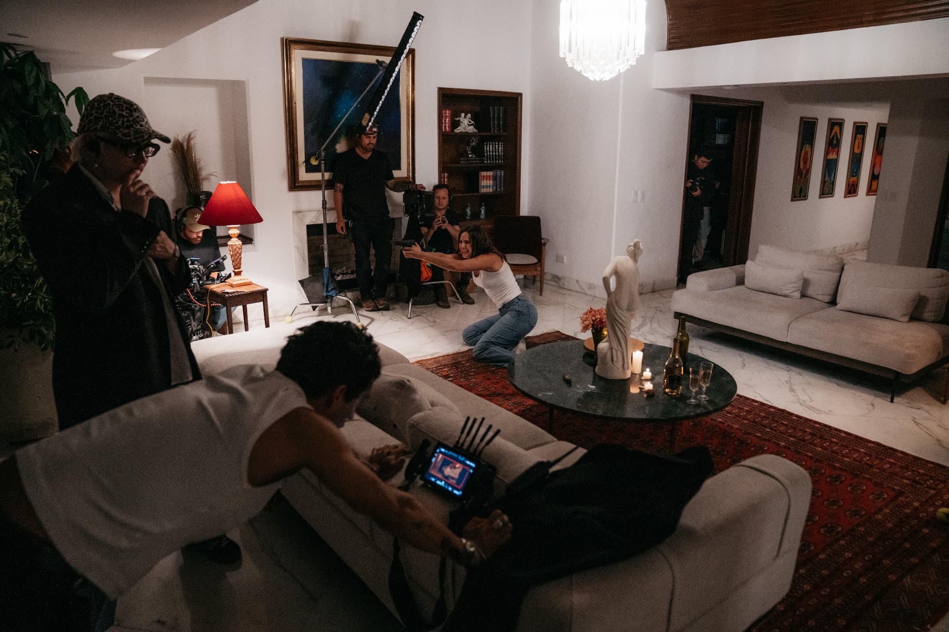 Juanma Sierra directing with a film crew on an interior set